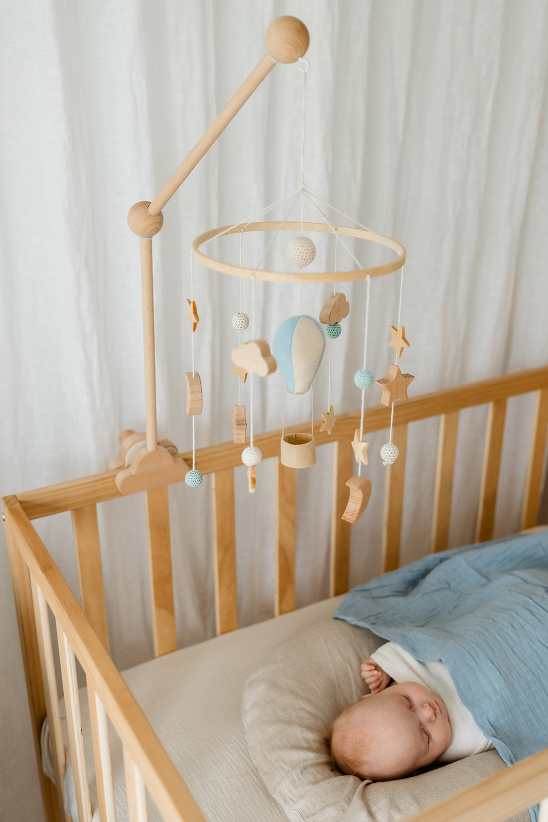 Felt blue balloon detail on nursery mobile