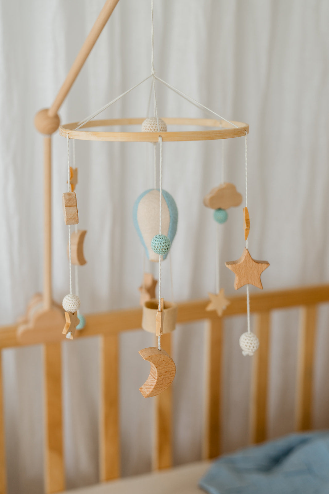 Blue balloon crib mobile side view