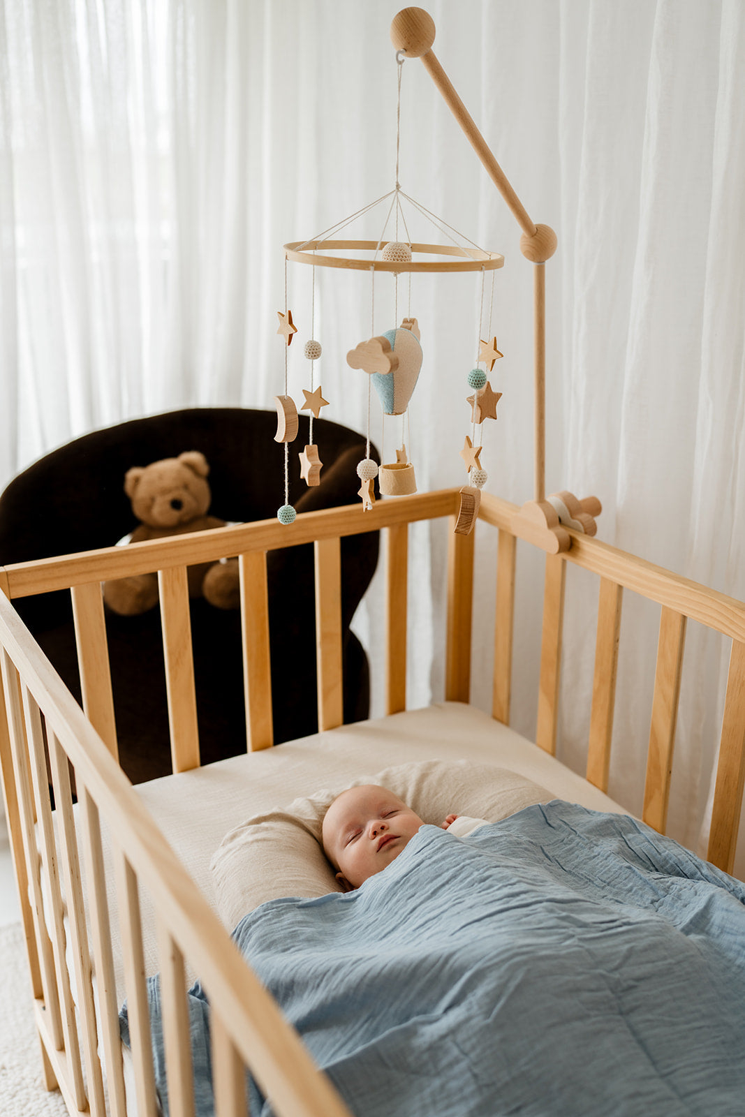 Blue balloon nursery decor mobile in baby room